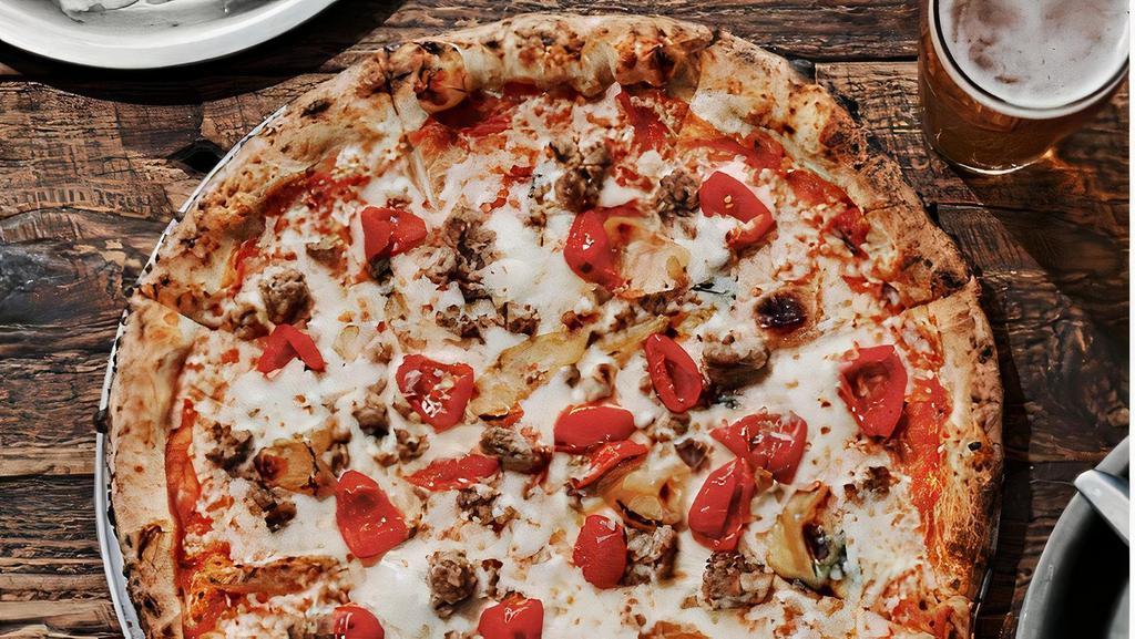 Amarena Red Pizza · Tomato sauce, black cherry sausage, sweet peppadew peppers, caramelized onions, mozzarella, and fresh basil.