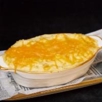 Shepherd'S Pie · Ground angus beef sautéed with red onions, carrots, corn and peas topped with our creamy mas...