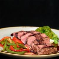 Delmonico Pepper Steak · Grilled to the desired temperature, topped with a black peppercorn red wine reduction sauce ...