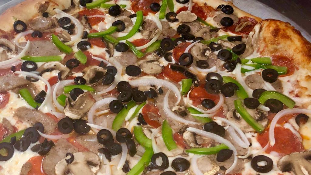 Veggie Pizza · Peppers, onions, fresh sliced tomatoes, black olives, mushrooms, and spinach.