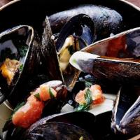 Steamed Mussels · Gluten free. Chorizo, Shallots, Aix Herb Butter, and Grilled Ciabatta.