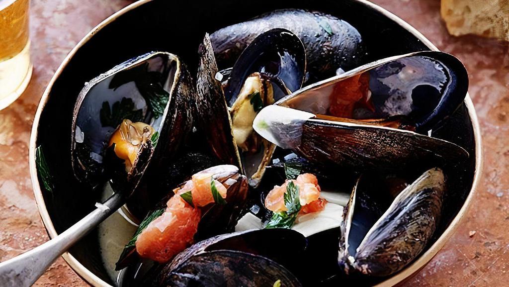 Steamed Mussels · Gluten free. Chorizo, Shallots, Aix Herb Butter, and Grilled Ciabatta.