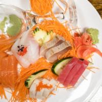 Sashimi Regular (D) · 12 pieces chef's choice sliced raw fish.