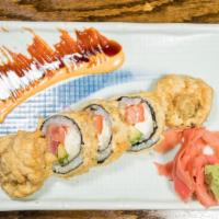House Special Roll · Tuna, smoked salmon, avocado, and cream cheese roll, deep-fried with tempura batter, served ...
