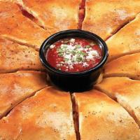 4 Meat - 4 Cheese Calzone · Our Signature Calzone Ring® stuffed with Four Meats and Four Cheeses. Brushed with Garlic Bu...