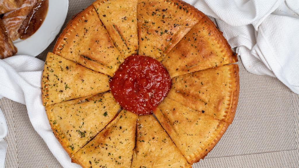 Pepperoni Calzone · Our Signature Calzone Ring® stuffed with Four Cheeses and Pepperoni. Brushed with Garlic Butter and Garlic Parmesan. Served with Marinara or our Famous Ranch Dressing.