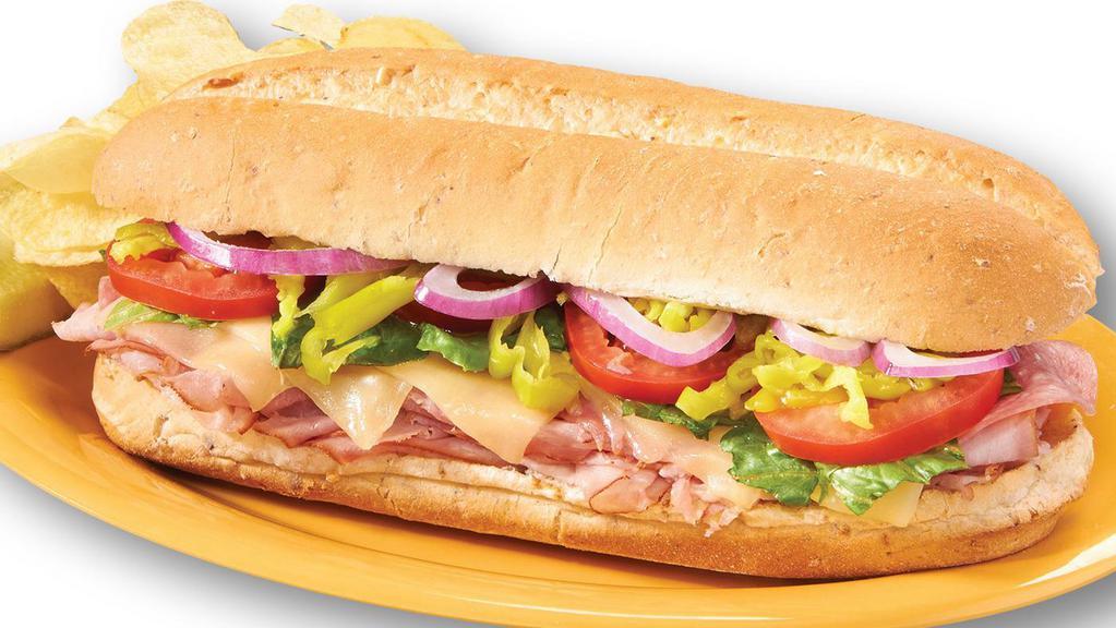 Italian Sub · Shaved Ham, salami, provolone cheese, red onions, diced pepperoncini's, sliced tomato, lettuce, and zesty Italian dressing.