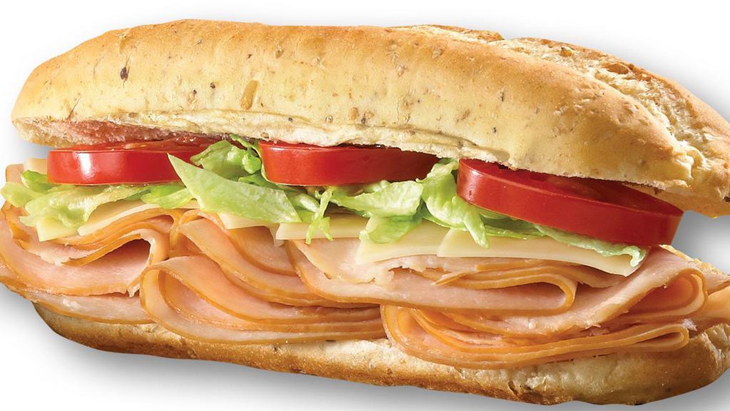 Turkey & Provolone · Sliced, tender turkey breast with red onions, provolone cheese, lettuce and tomato; served with deli mustard, and mayo.