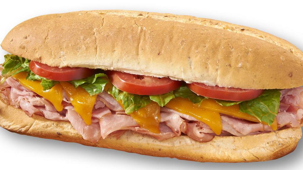 Ham & Cheddar · Shaved ham, melted cheddar cheese, lettuce and tomato with our creamy Italian dressing.