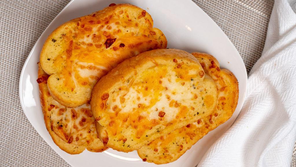 Garlic Cheese Toast (4 Slices) · Italian bread brushed with garlic butter, topped with four-cheese blend and toasted golden brown. Served with your choice of either marinara or ranch.