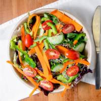 Garden Salad · Crisp field greens and romaine lettuce with cucumbers, roasted bell peppers, carrots, tomato...