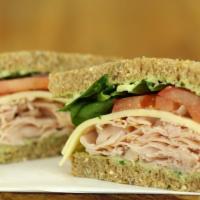 Country Smoked Turkey Sandwich · Smoked turkey breast, melted pepper jack cheese, roasted onions and peppers, sliced red onio...