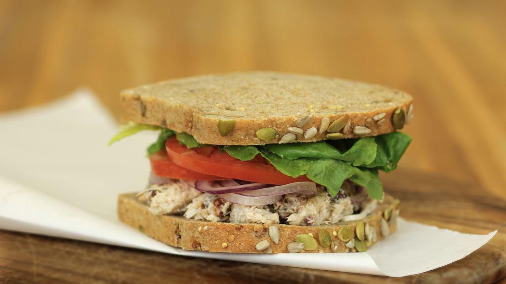 Louisville Chicken Salad · Chunks of white chicken and spiced pecans in a seasoned mayonnaise, topped with fresh tomato, red onion and lettuce on honey whole wheat bread. 710 cal.