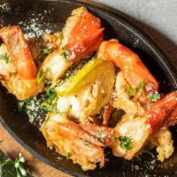 Sizzling Jumbo Shrimp Scampi · Jumbo Shrimp in garlic butter sauce served to you on a hot skillet at 120 degrees.