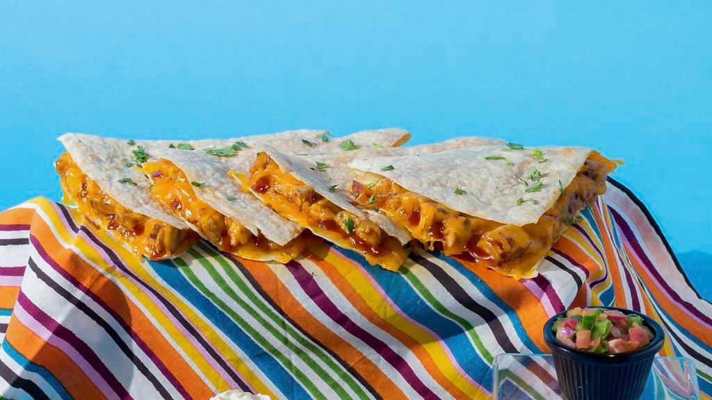 Bbq Chicken Quesadilla · BBQ chicken, shredded melted cheese, onions, and BBQ sauce in a crispy flour tortilla and served with a side of pico de gallo and sour cream.
