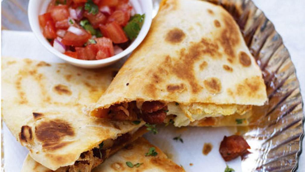 Chorizo And Potato Quesadilla · Chorizo, potatoes, and shredded melted cheese in a crispy flour tortilla and served with a side of pico de gallo and sour cream.