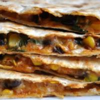 Corn And Black Bean Quesadilla · Corn, black beans, and shredded melted cheese in a crispy flour tortilla and served with a s...