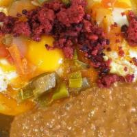 Huevos Rancheros · 4 huevos esterllados con salsa ranchera arriba y arroz y frijol alado.
4 over easy eggs with...