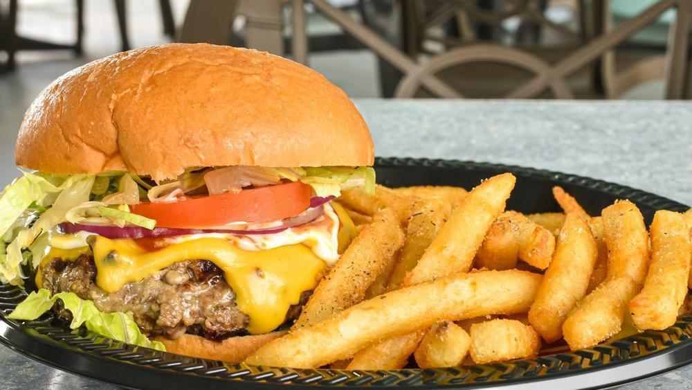 Oleta Angus Burger · All Angus beef patty topped with American cheese, lettuce, tomato, and onions on a brioche bun.