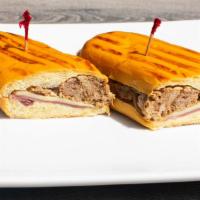 Medianoche Sandwich · MidNight: ham, Swiss cheese, and pork on sweet bread.