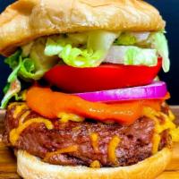 Bustin Barbeque Burger · Homemade barbeque sauce, vegan cheese, vegan mayo, grilled onions, lettuce, plant based burg...