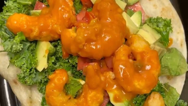 Bbq Shrimp Wrap · Homemade BBQ sauce, vegan shrimp, marinated kale , tomatoes, avocado on a lightly toasted wrap.