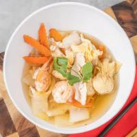 Wonton Soup · Wonton soup is a classic for a reason. Ours is brimming with shrimp, chicken, carrot, napa c...