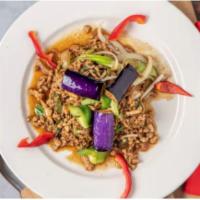 Hot Stuff Kra Pow · Spicy basil, eggplant, green onions, bell peppers and holy basil stir-fried in our flavorful...