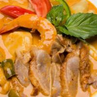Ruby Red Curry · Ruby red curry, infused with coconut milk, bamboo shoots, squash, and garnished with fresh b...