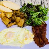 L’American Breakfast Plus A Drink · Two eggs (choose style), bacon, or smoked salmon, mixed greens, homemade potatoes, bread, pl...