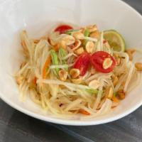 Papaya Salad · Shredded green papaya tossed with tomatoes, string beans, lime juice, chili, garlic, peanuts...