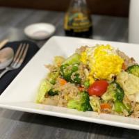 Fried Rice · Fried rice, prepared in Thai wok, with egg, tomatoes, scallions, onion, green peas, and carr...