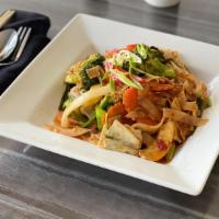 Pad Kee Mao (Drunken Noodle) · Spicy stir fried rice noodles, prepared in Thai wok, with bell pepper, bamboo shoots, onion,...