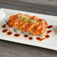 Volcano Krab Roll (10) · California Roll topped with baked krab and drizzled with eel sauce. Side of wasabi, ginger a...