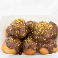 Dark Chocolate Loukoumades · Vegan Donuts 
Melted dark chocolate, sprinkled with crushed pistachio.