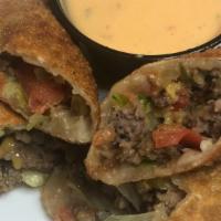 The Cheeseburger Roll · (Ground Beef, Pickles, Onion, Cheddar Cheese, Lettuce, Tomatoes)
