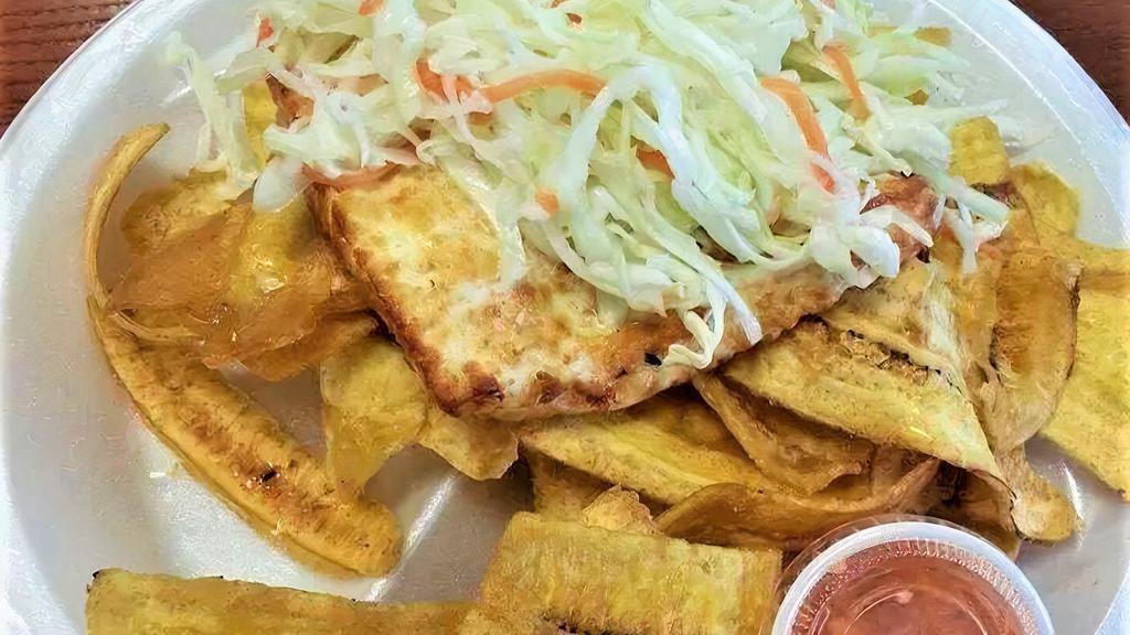 Tajadas Con Queso · Fried green plantains with fried cheese, served with salad.