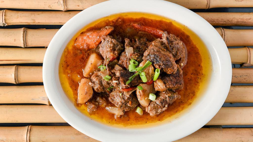 Beef Kaldereta · Beef stew with carrot, potato, and bell peppers.