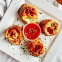 Pepperoni Pinwheels · Made with pepperoni & cheese & served with a side of marinara sauce.