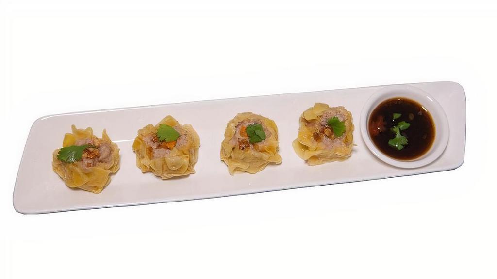 Thai Dumpling · Handmade steamed dumpling with shrimp, chicken, and pork served with sweet chili soy sauce mix.