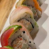 Tiger Maki · Snow crab meat mixed with mayo sauce and cucumber topped with tuna,salmon, shrimp and avocad...