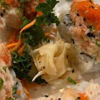 Volcano Roll · California roll topped with dynamite. **Raw/undercooked**