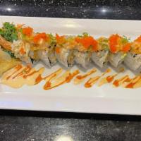 Ocean Roll · Shrimp tempura, fish tempura, snow crab meat, avocado, cucumber topped with spicy raw scallo...