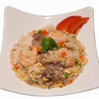 House Fried Rice · Fried rice in brown sauce with chicken, beef, shrimp, onion, tomato, pea, carrot and egg.