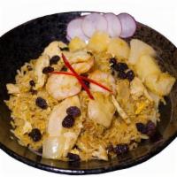 Pineapple Fried Rice · Fried rice in brown sauce with chicken, Fried rice in curry powder with chicken, shrimp, pin...