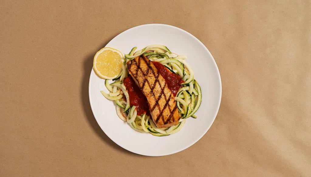 Salmon Vodka Zoodles · Zucchini noodles in a creamy tomato vodka sauce with seasoned salmon and fresh Parmesan cheese.