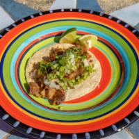 Chuleta Ahumada  Taco · Smoked pork chop cooked with pineapple topped with onions and cilantro