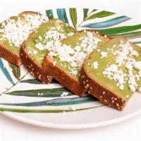 Smashed Avo Toast · Smashed Avocado on toasted Whole Wheat Bread topped with Olive Oil, Feta Cheese, Salt & Pepp...