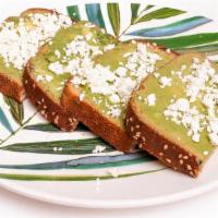 Guac Toast · House Guacamole on toasted Whole Wheat Bread topped with Olive Oil, Feta Cheese, Salt & Pepp...
