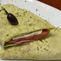 Caprese Wrap · Fresh mozzarella, sundried tomato, black olives, basil, artichoke & prosciutto.